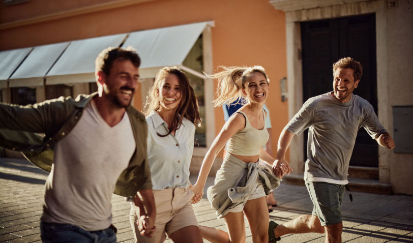 Happy friends enjoying a run outdoors